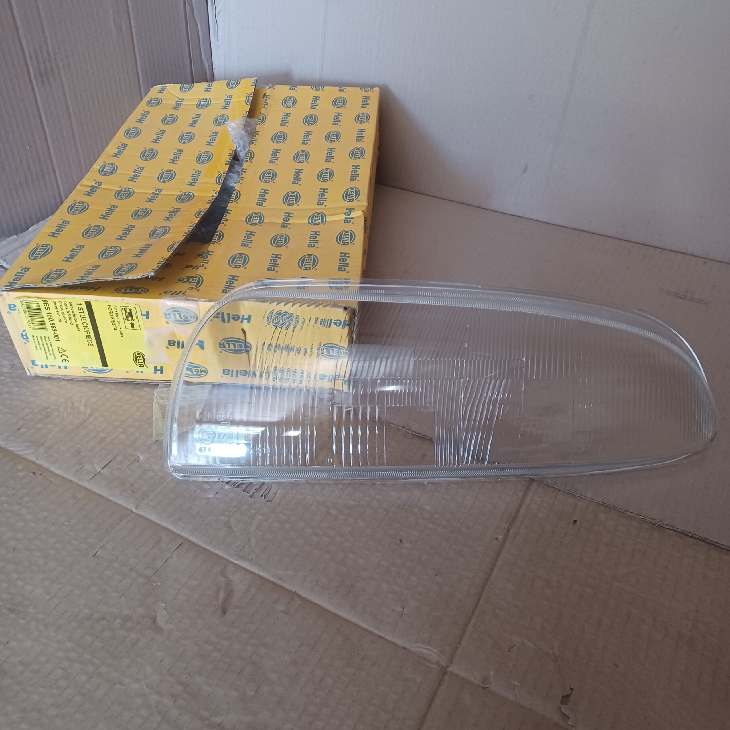 Verre de phare gauche Ford Fiesta IV 1995-2002 Neuf Hella Arrivages Auto Pieces